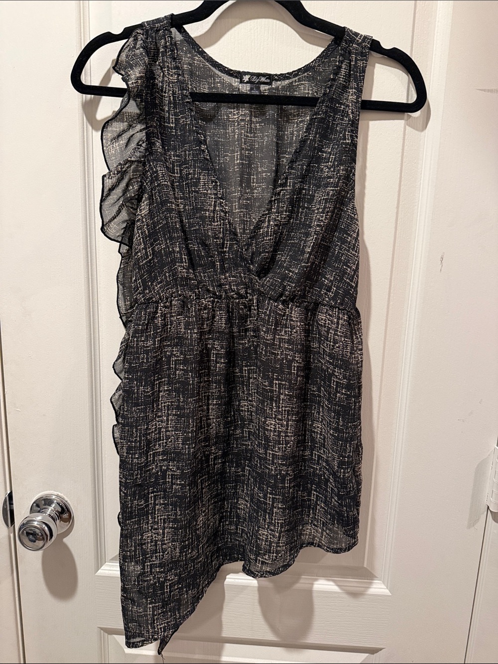 Lily White Black and Ivory Ruffle-Accent Sleeveless sheer Top